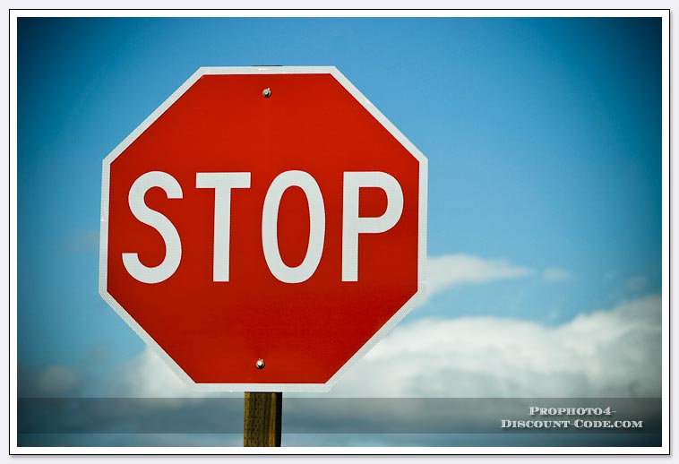 Stop-sign-blue-sky-and-clouds